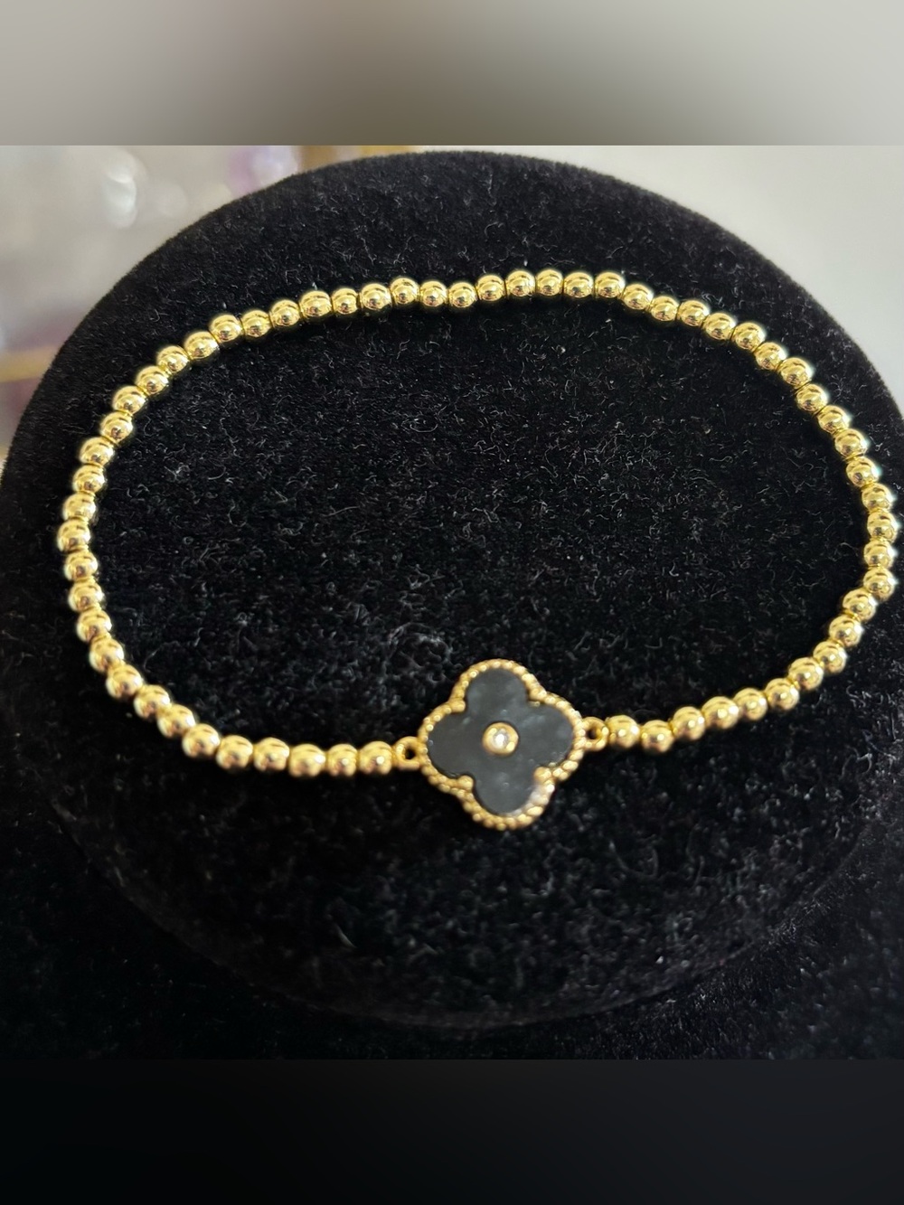 Gold Beaded Bracelet with Black Clover Pendant